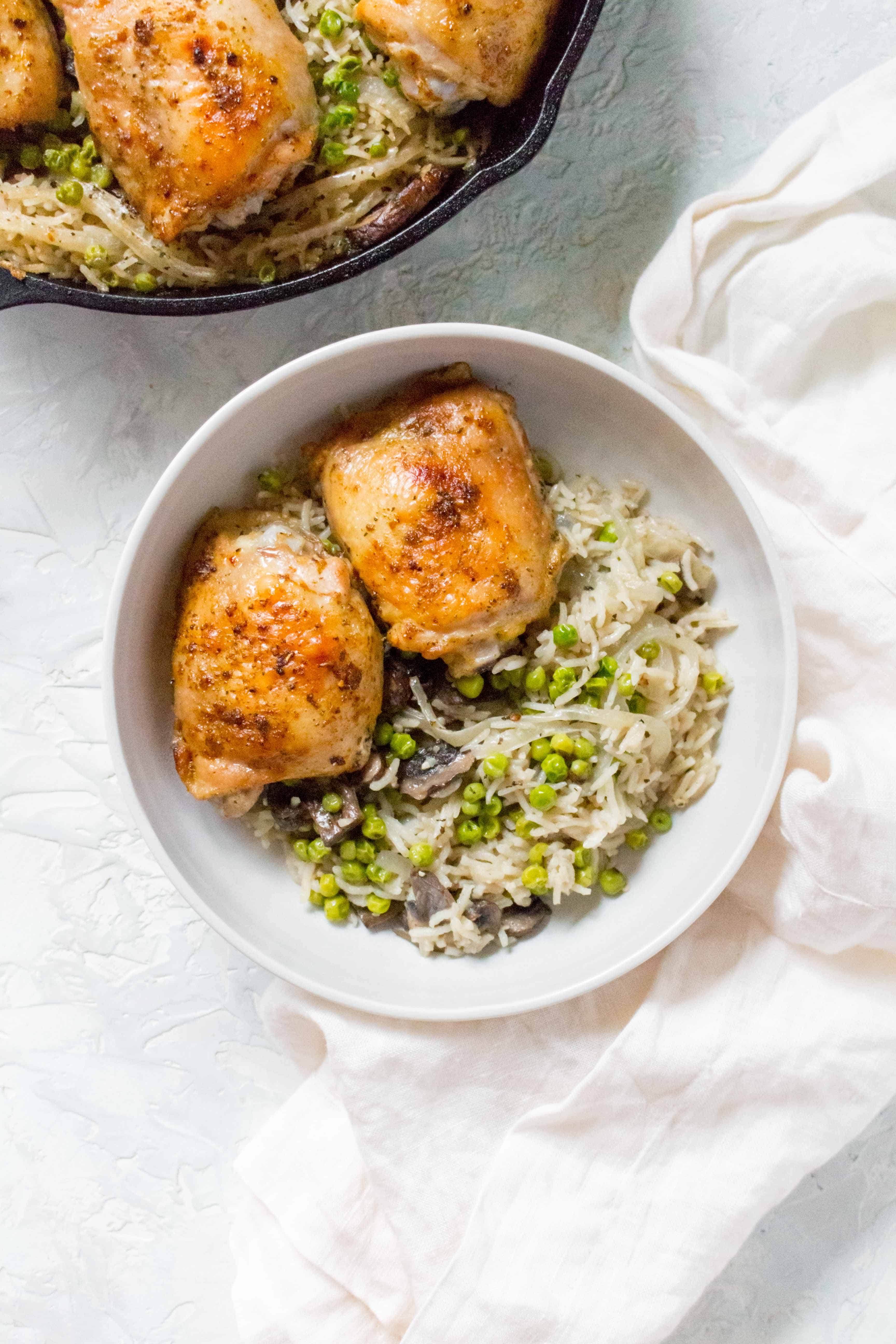 Grab your cast iron and make this one pot crispy and juicy chicken thighs with mushroom, onions, and pea rice tonight!