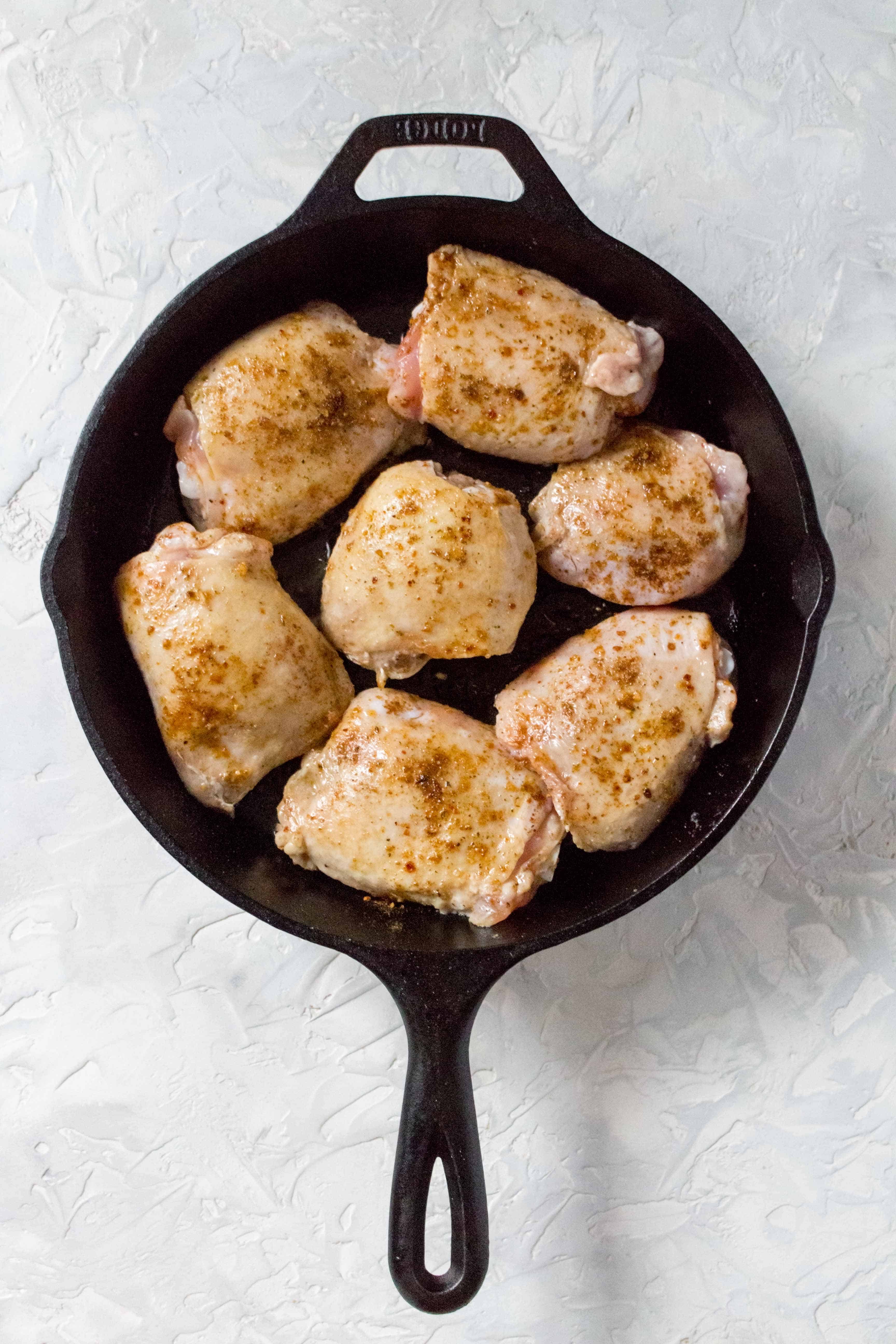 one pot chicken and rice: In a cast iron (or oven safe pan) on medium heat, add in olive oil, and the chicken thighs, skin side down. Cook for 4 minutes before flipping them and letting them cook for another 4 minutes. using tongs, carefully remove the chicken and set aside.