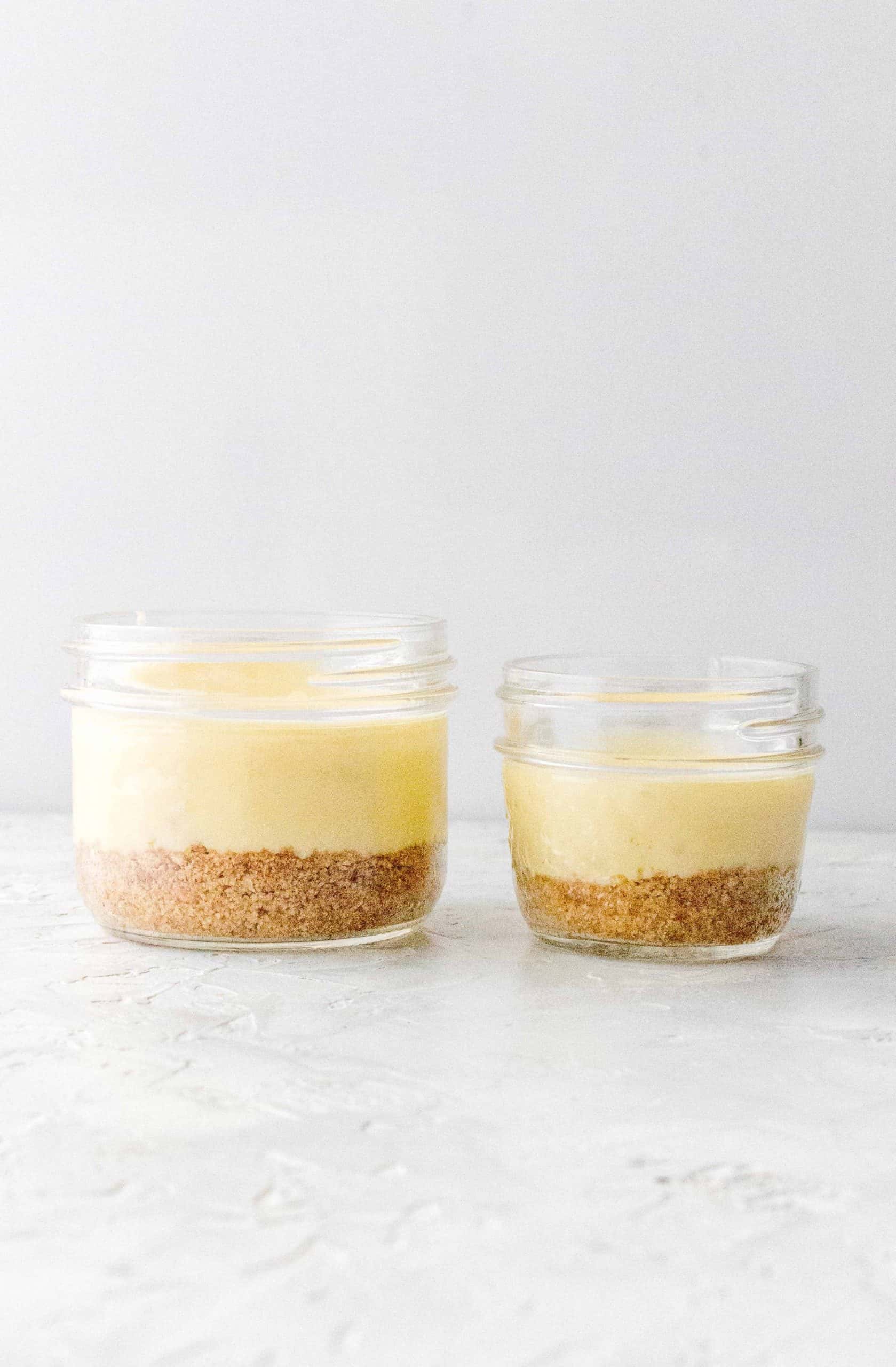 Two different sized mason jar instant pot cheesecakes. 