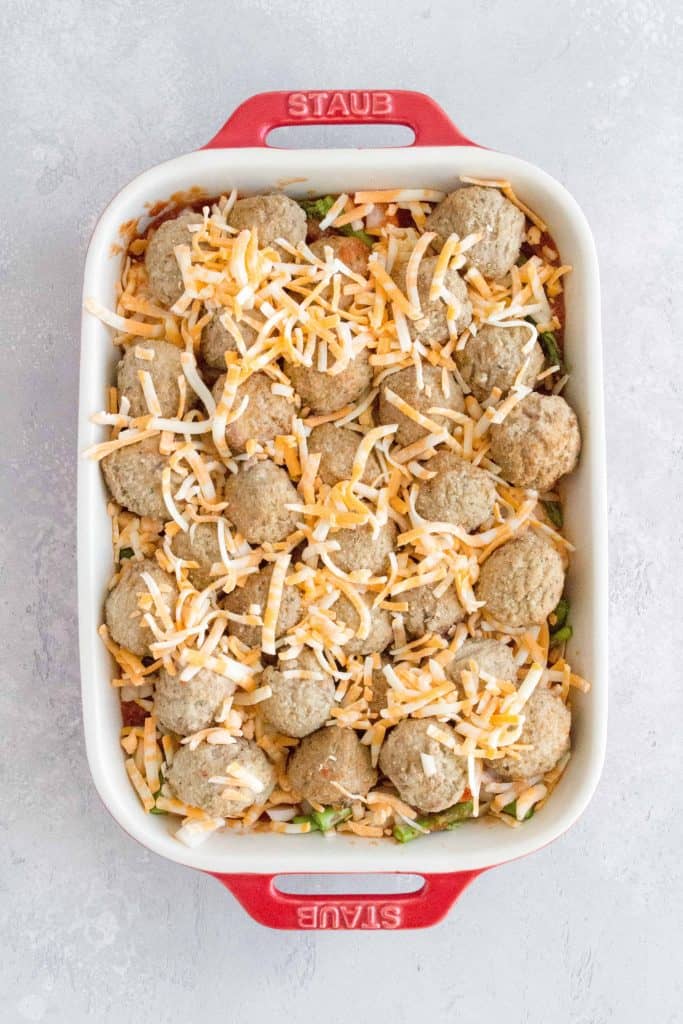 meatballs nestled in and sprinkle more cheese on top