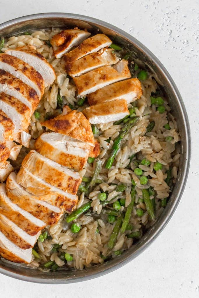This One Pot Creamy Orzo, Chicken, Asparagus, and Peas makes for the perfect weeknight dinner. Cooked in one pan, the layer of flavours makes this dish plate-licking good!