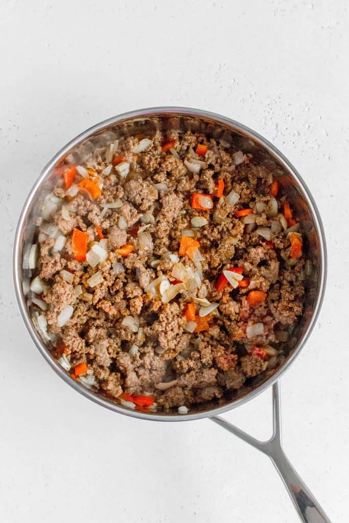 ground beef and taco seasoning added into a skillet
