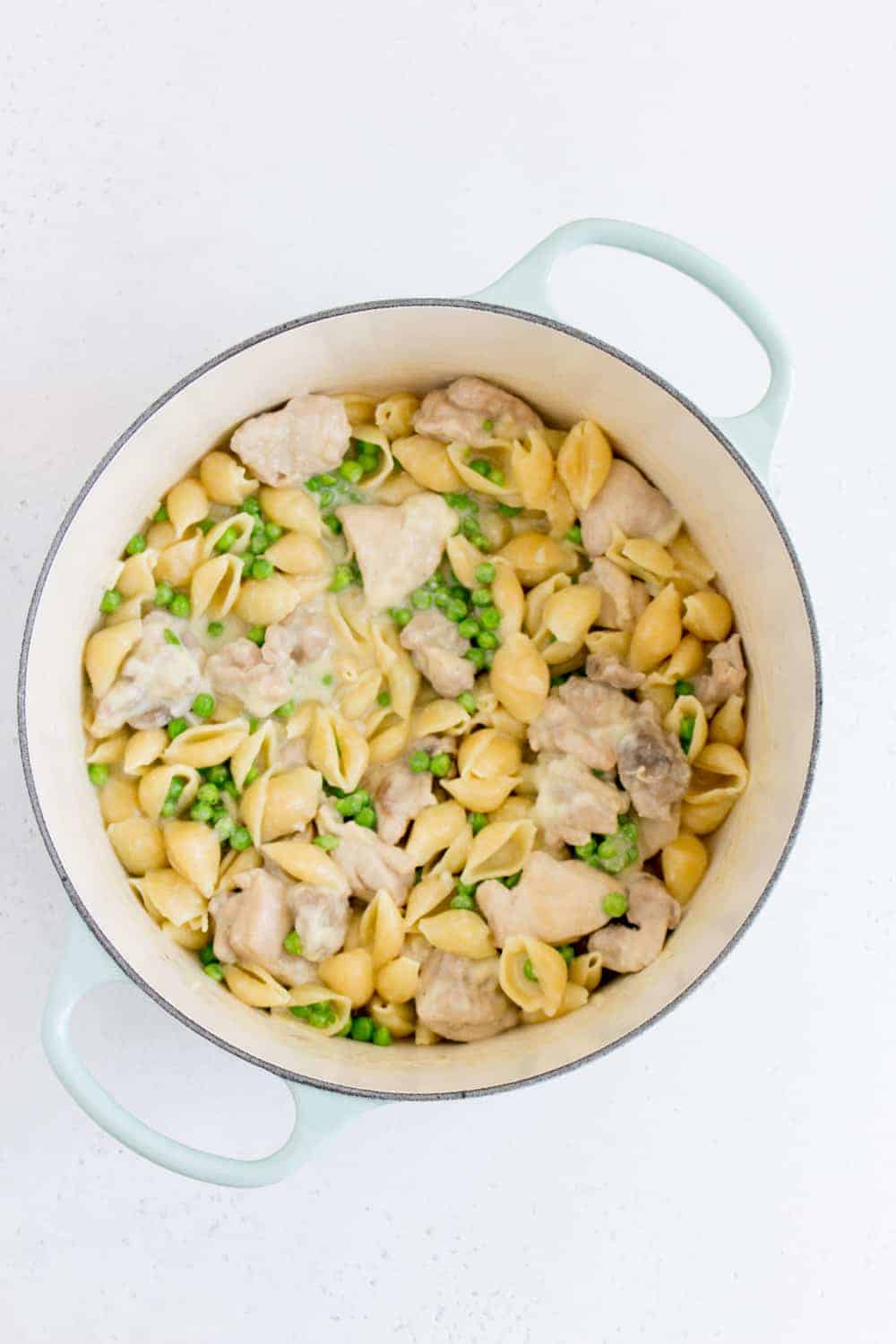 dutch oven with garlic parmesan pasta with peas and chicken