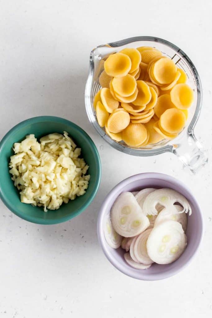 bowl of minced garlic, shallots, pasta
