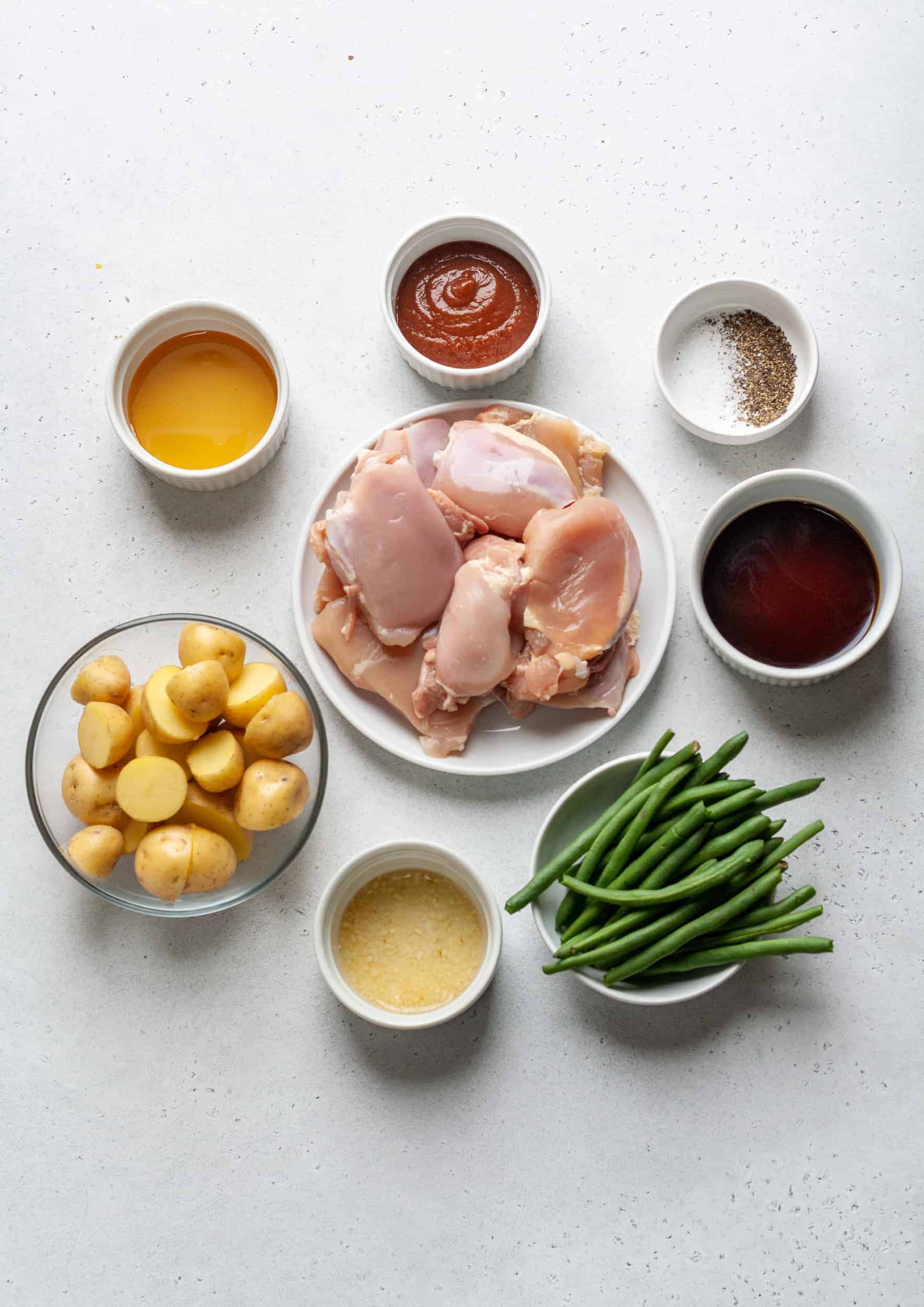 Ingredients needed to make a slow cooker chicken and potatoes with honey garlic.