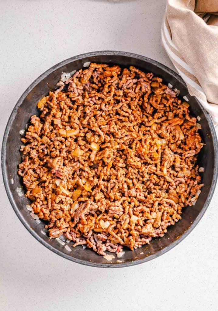 Cooked ground beef in a pan.