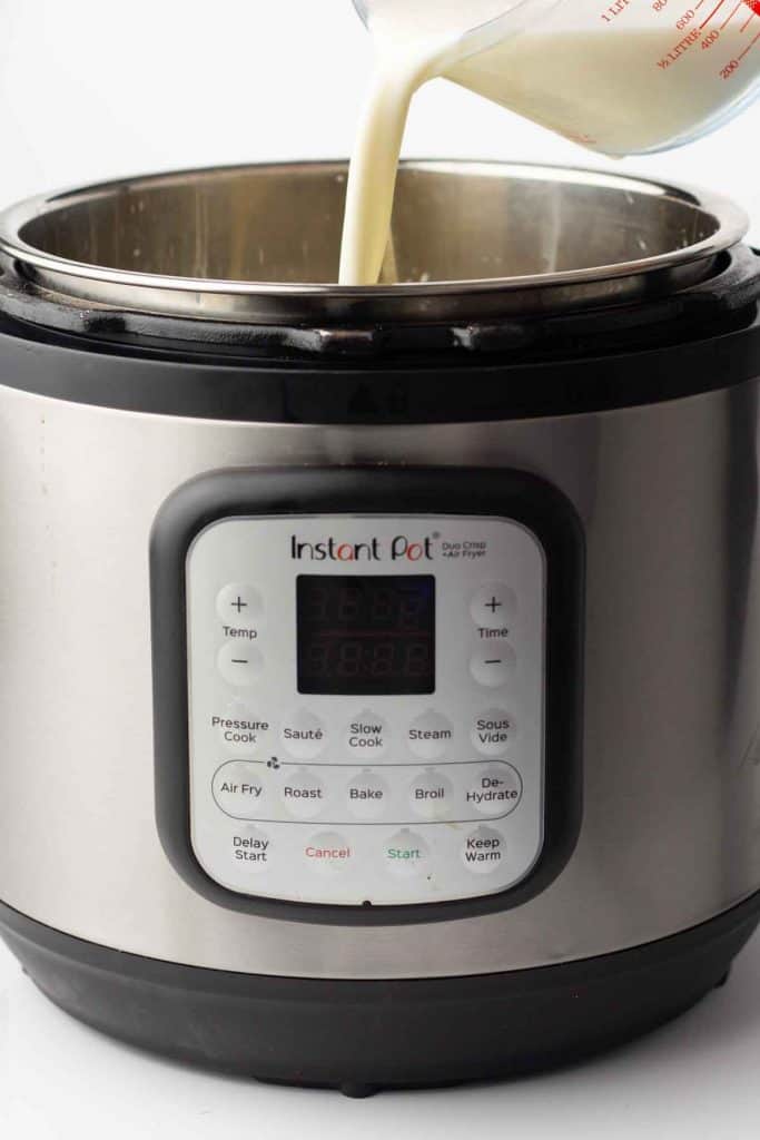 Milk being added to an Instant Pot.