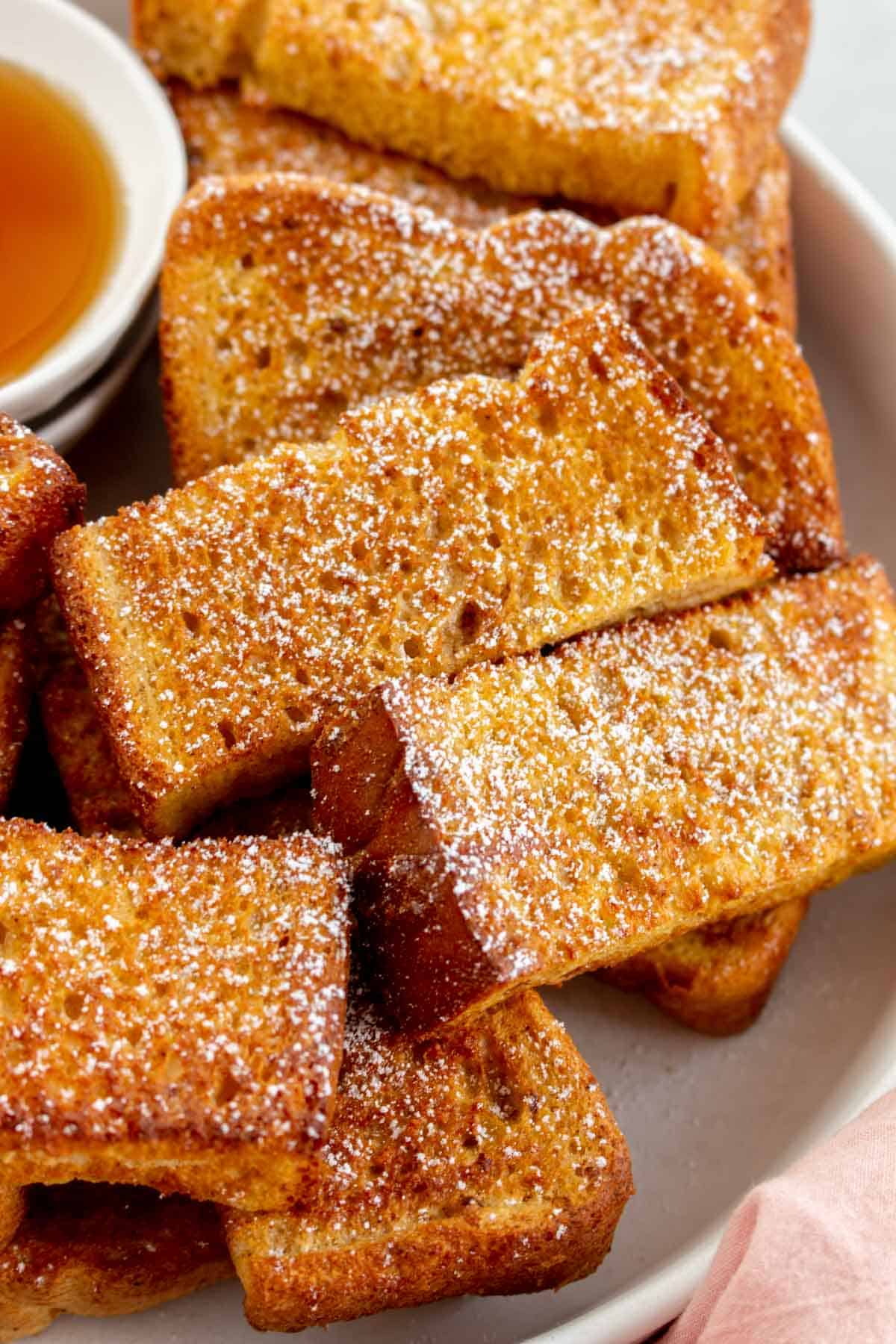 Close up of air fryer french toast sticks.