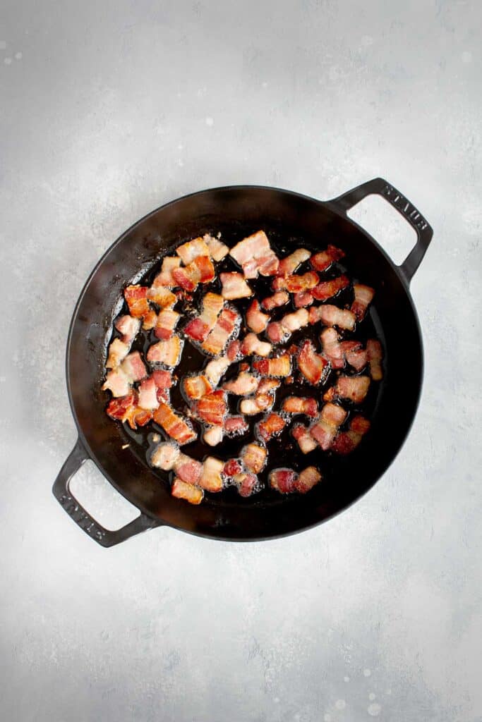 Bacon cooking in a pan.