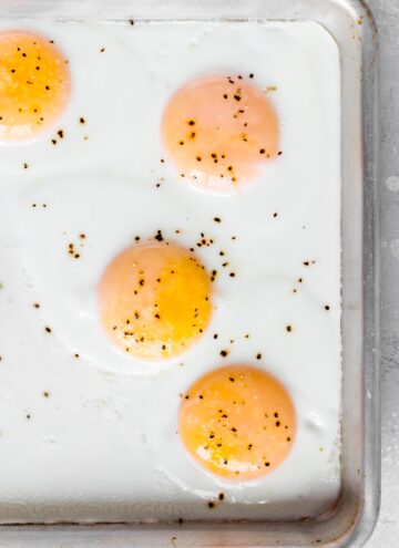 Close up of a sheet pan with eggs.