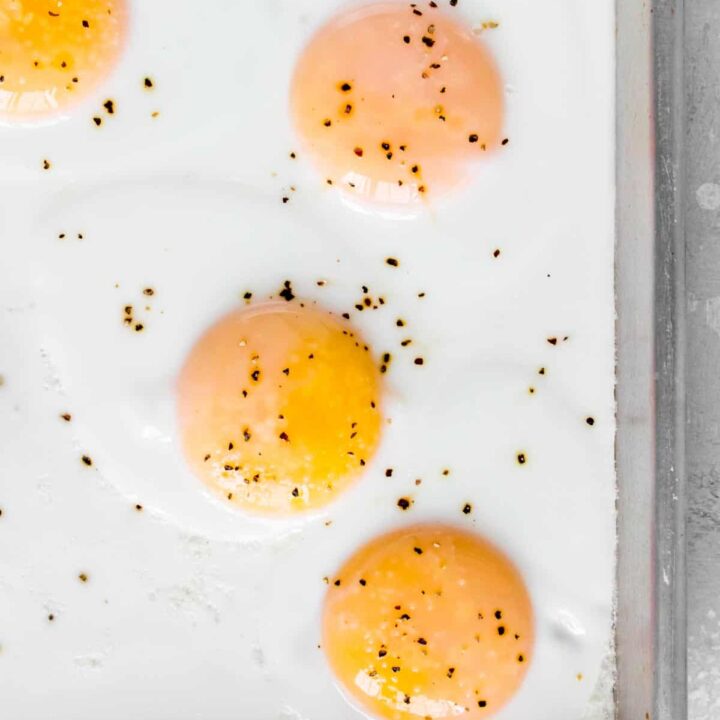 Close up of a sheet pan with eggs.