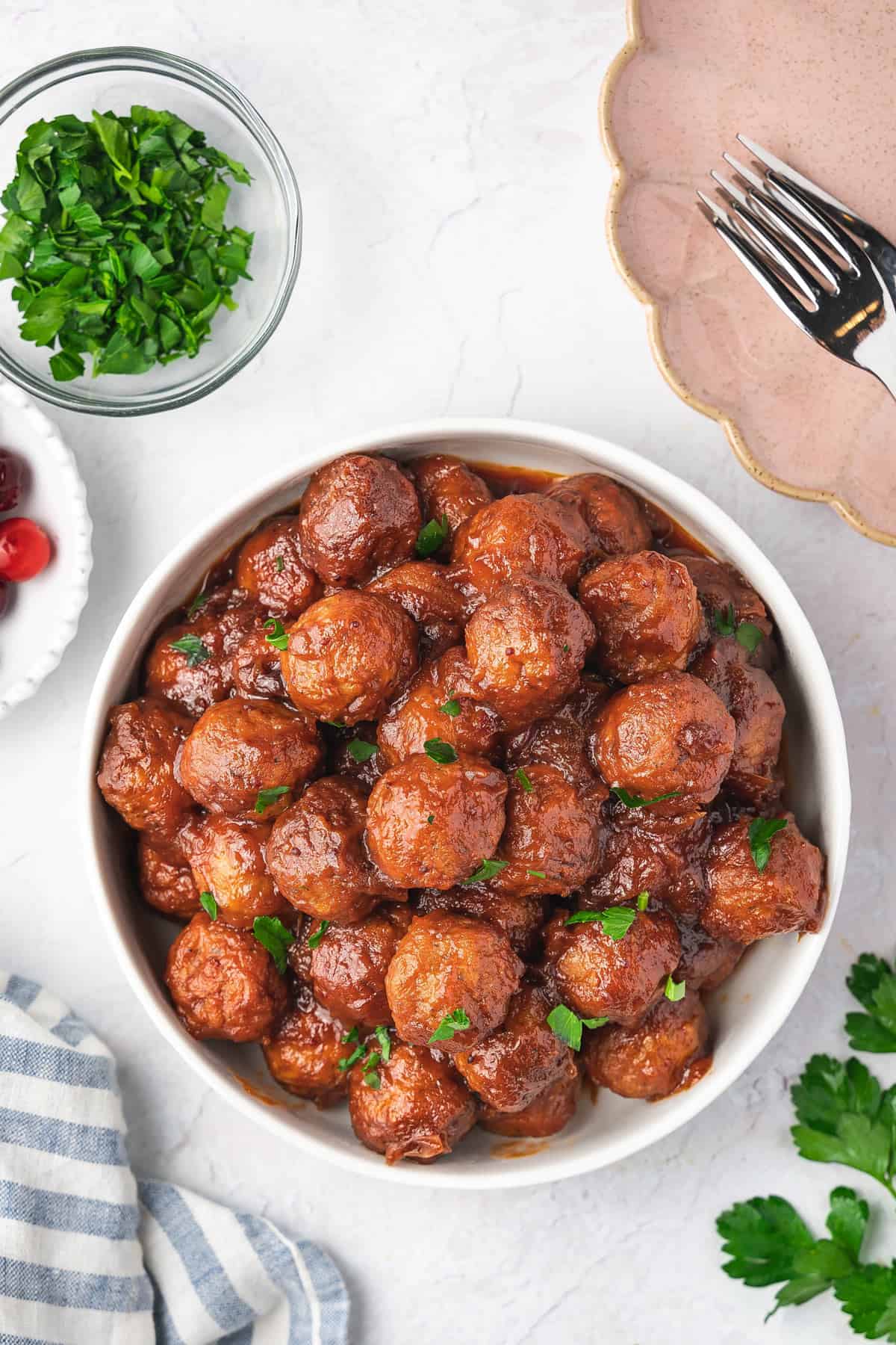 Overhead view of a bowl of slow cooker cranberry meatballs.