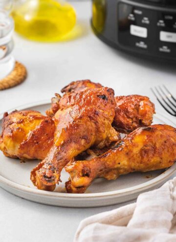 A plate of slow cooker chicken drumsticks.