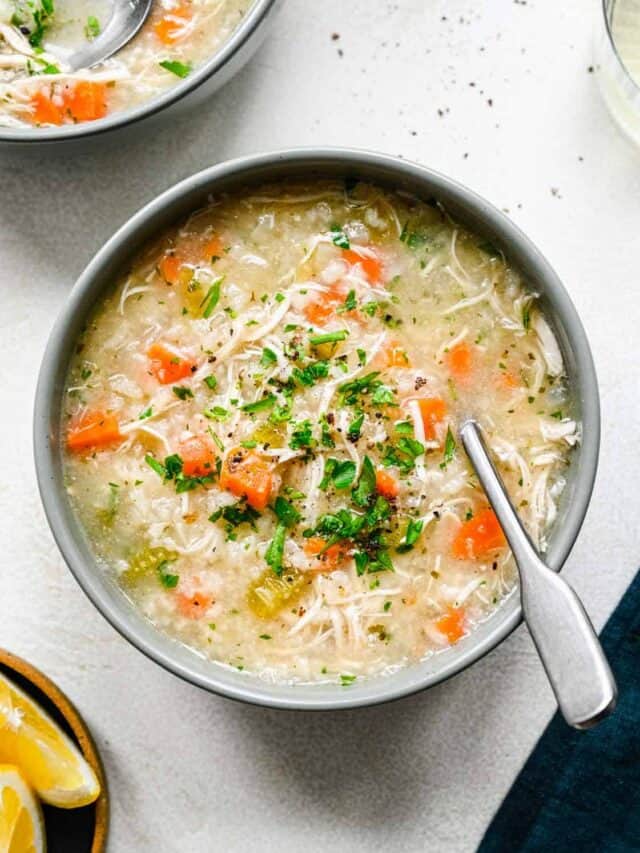 Overhead view of a bowl of instant pot chicken and rice soup with a spoon.