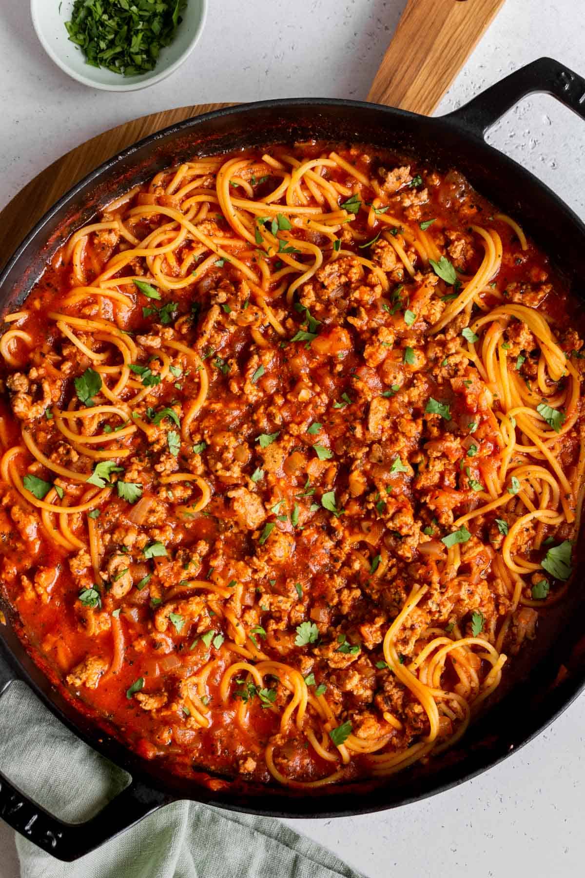 A large skillet of turkey spaghetti.