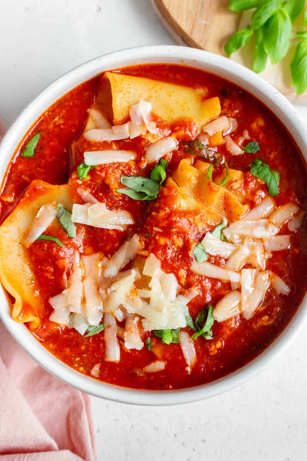 Overhead view of a bowl of lasagna soup.