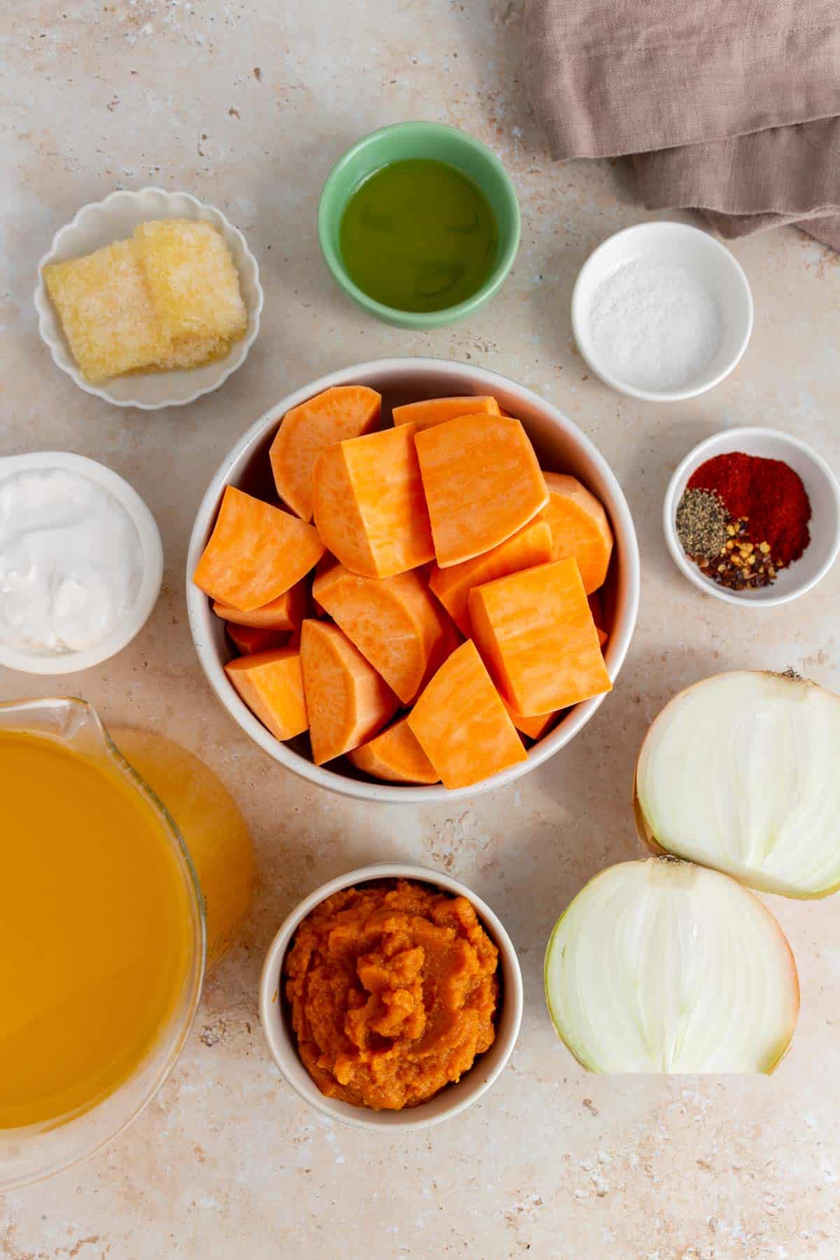 Ingredients needed to make sweet potato and pumpkin soup.