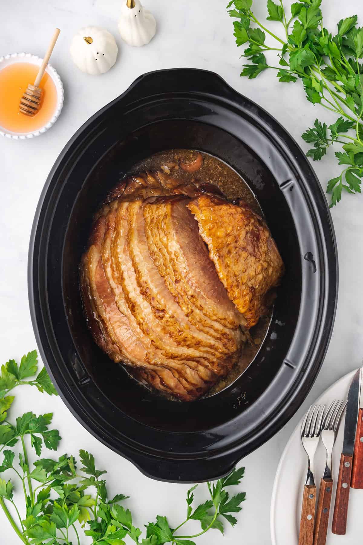 Overhead view of ham in a slow cooker.
